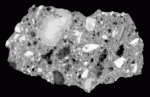 Single scan of suevite LB39-c from the Bosumtwi Crater, Ghana. Scan distinguishes the distribution, size and type of a variety of rock and melt clasts. (Sample courtesy of Dr. Christian Koeberl, University of Vienna).